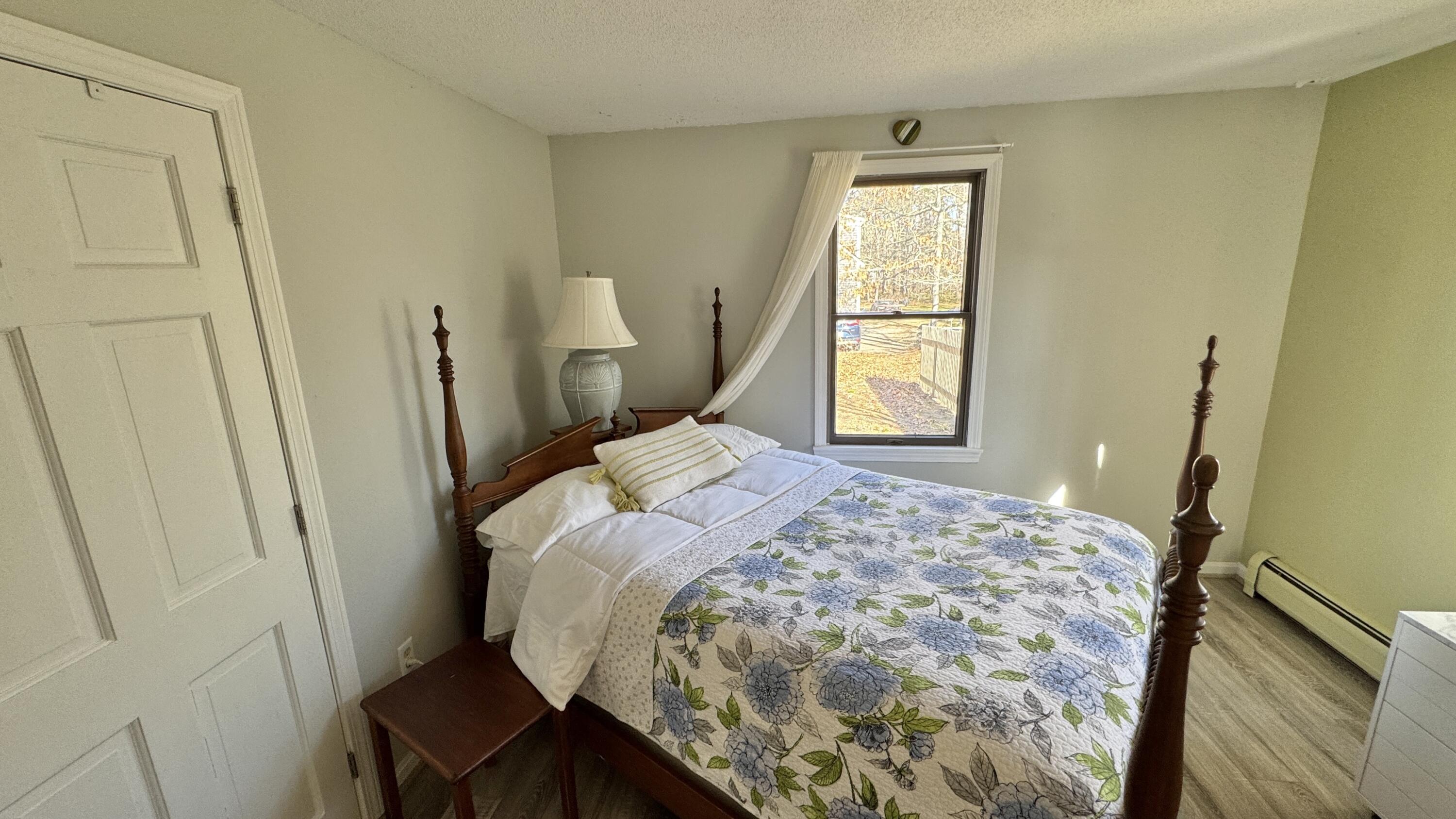 300 Brackett Road Eastham, MA 02642 - Photo 25 of 30 a bedroom with a bed and a window