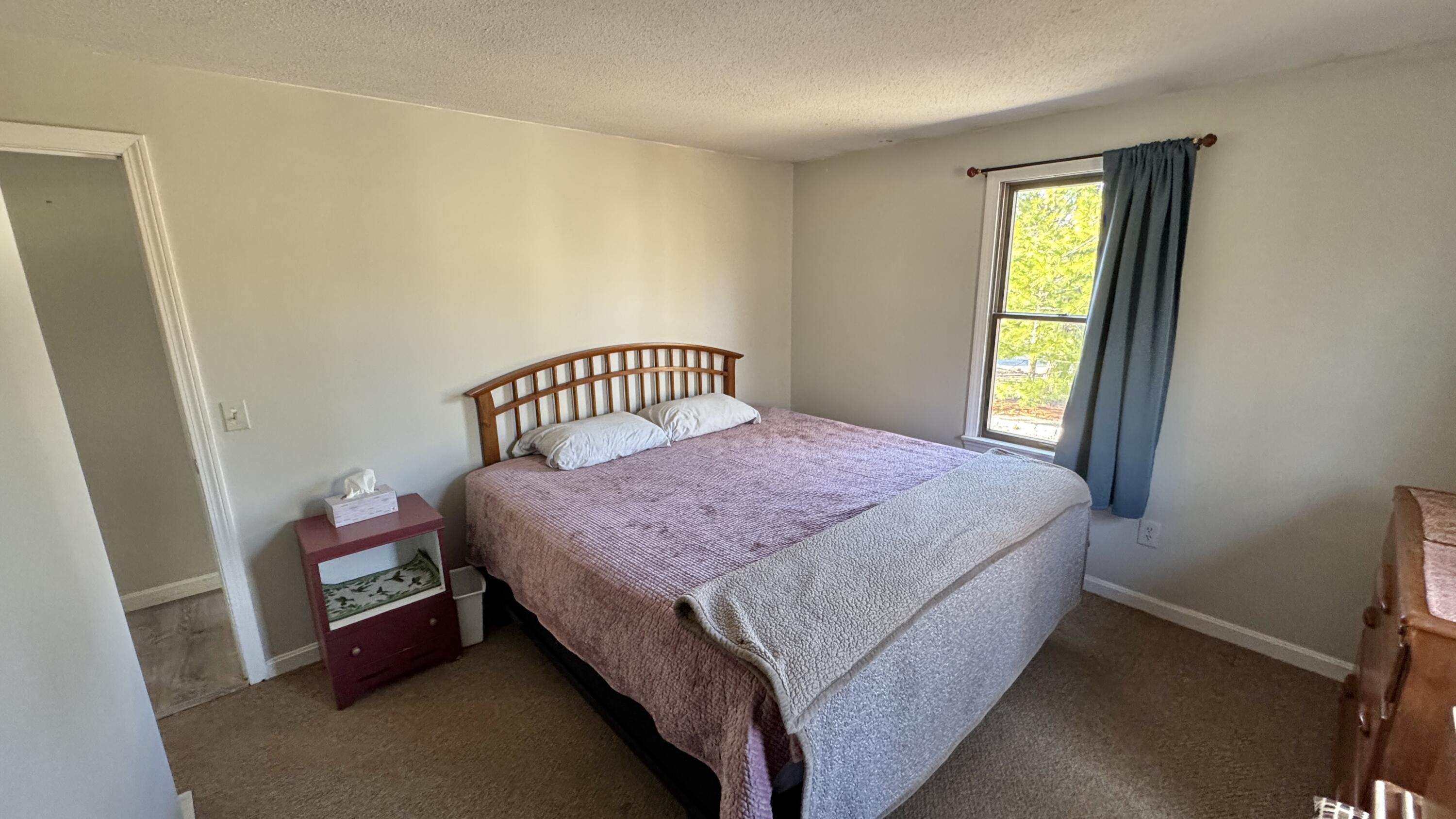 300 Brackett Road Eastham, MA 02642 - Photo 26 of 30 a bedroom with a bed and window