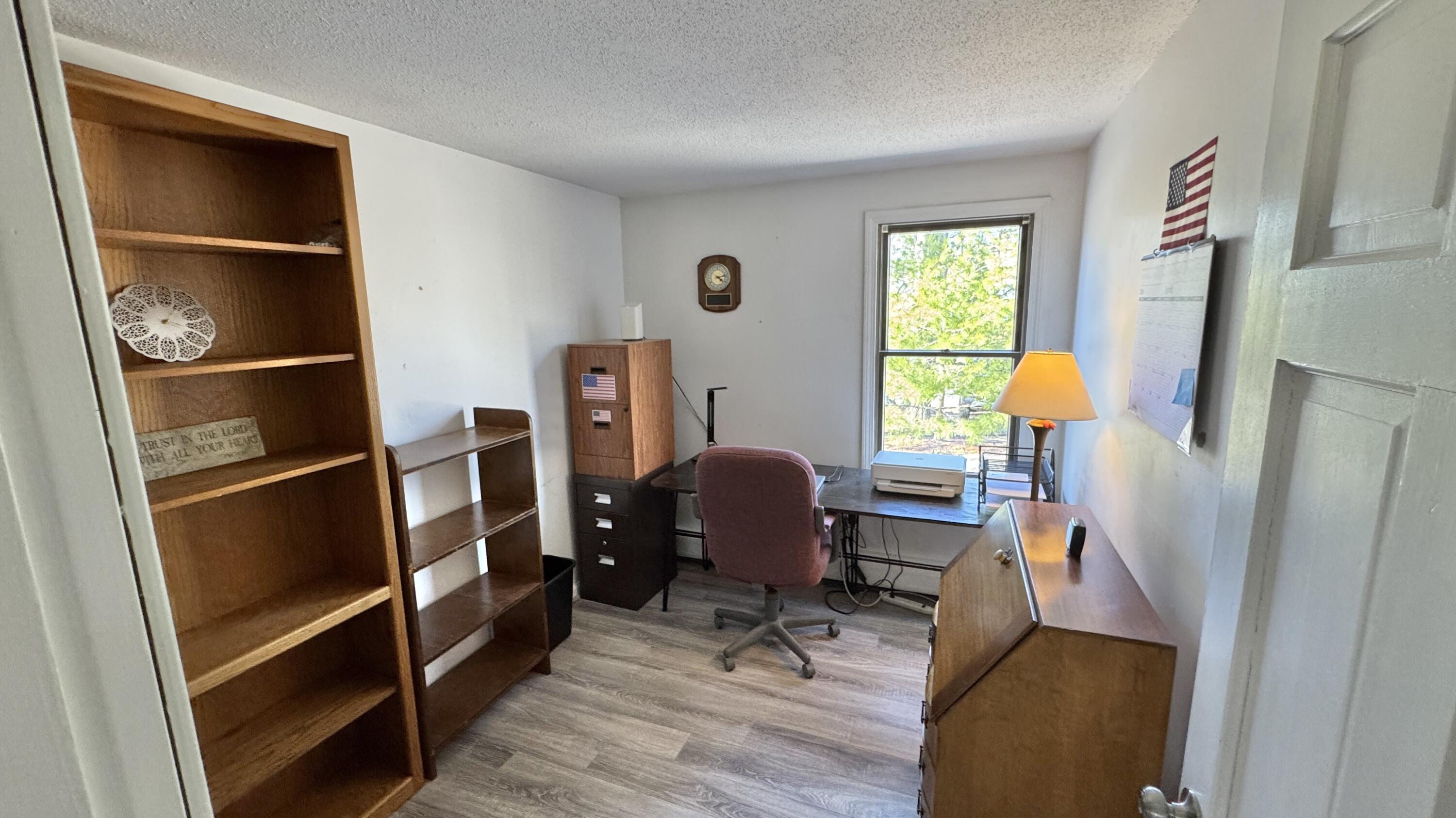 300 Brackett Road Eastham, MA 02642 - Photo 27 of 30 a view of a workspace with furniture and a window