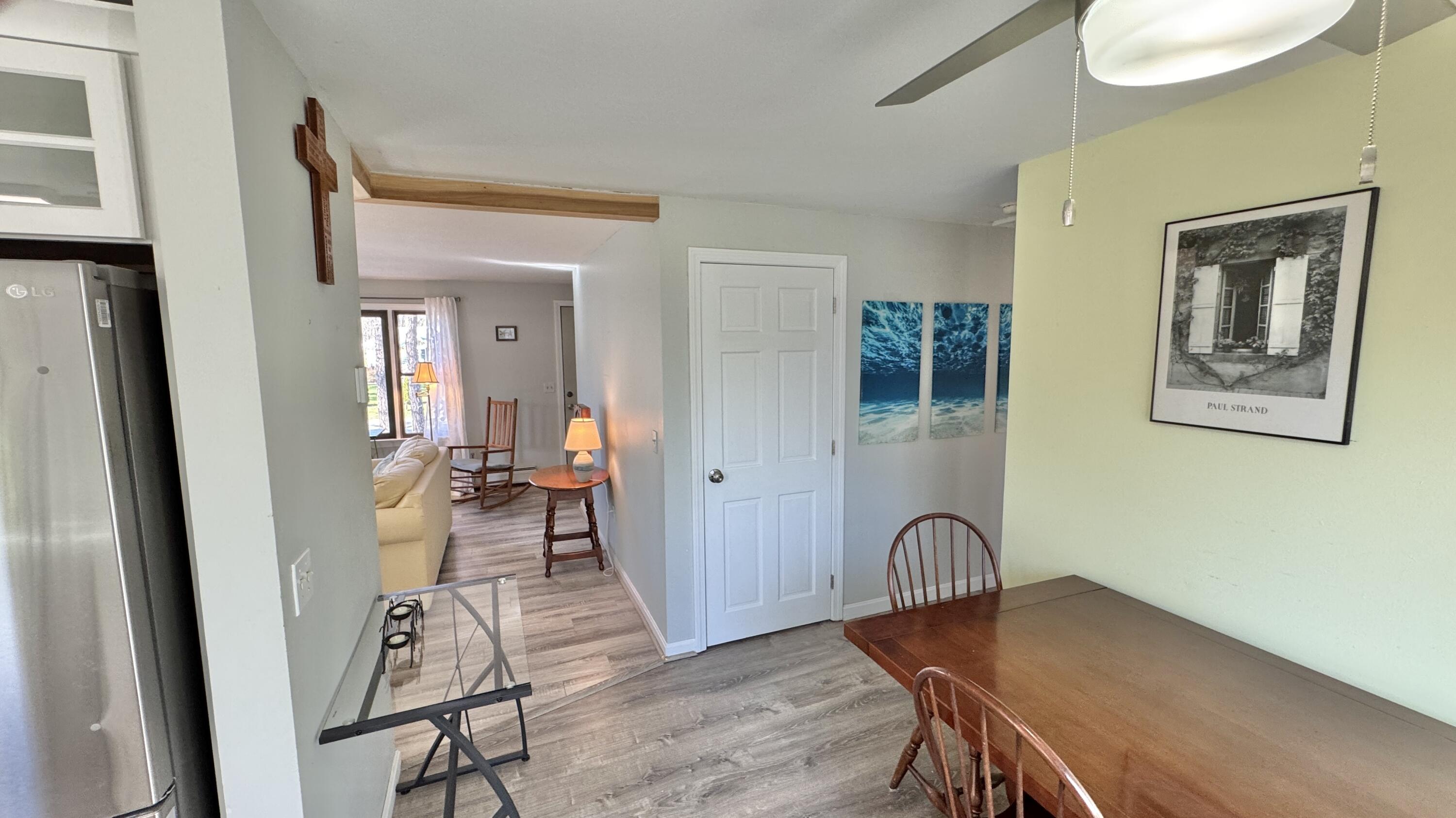 300 Brackett Road Eastham, MA 02642 - Photo 29 of 30 a view of a a dining room with furniture window and wooden floor