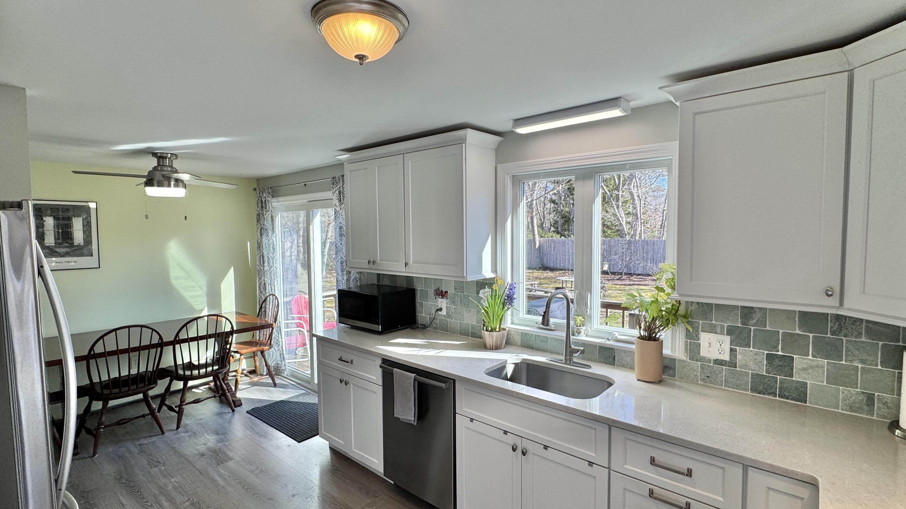 300 Brackett Road Eastham, MA 02642 - Photo 4 of 30 a view of kitchen and window with sink