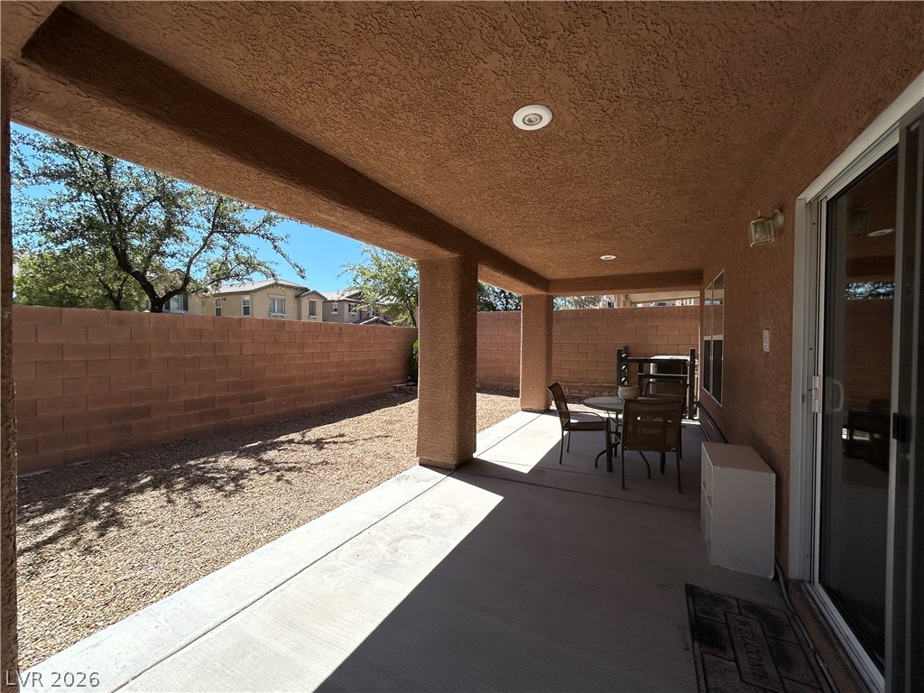 6538 Elm Spring Las Vegas, NV 89148 - Photo 24 of 29 An inviting covered patio offers a comfortable outdoor living space for relaxation and entertainment.
