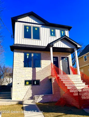 a view of a house with entrance gate
