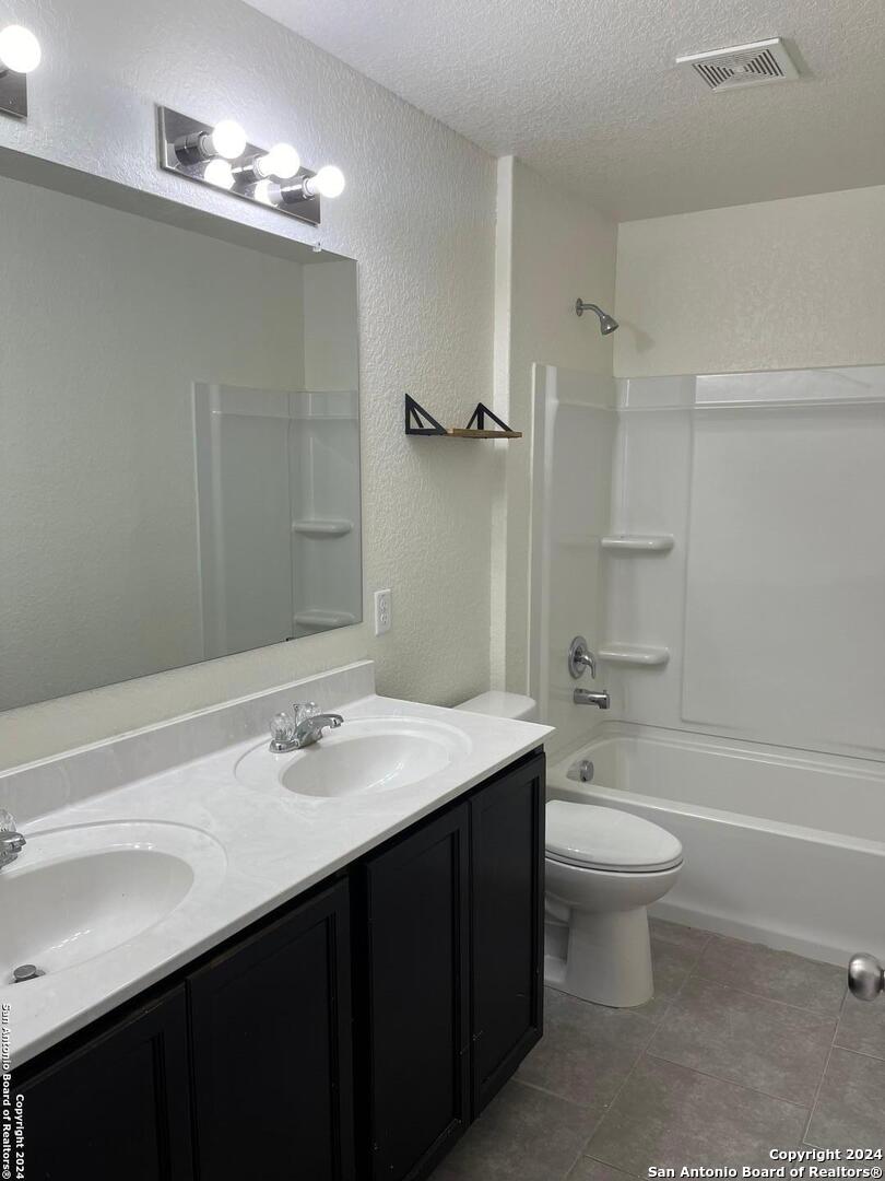 803 Roping Horse San Antonio, TX 78260 - Photo 11 of 18 a bathroom with a sink a toilet and shower