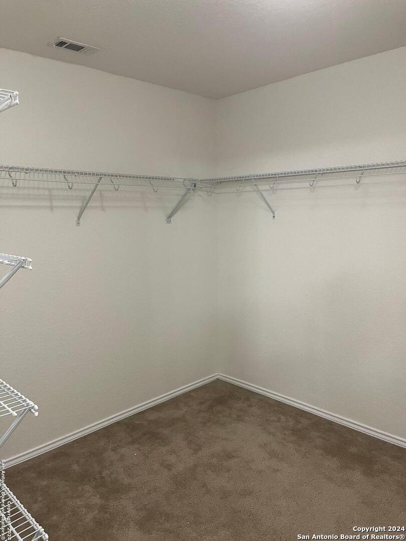 803 Roping Horse San Antonio, TX 78260 - Photo 15 of 18 a view of a room with racks on the wall