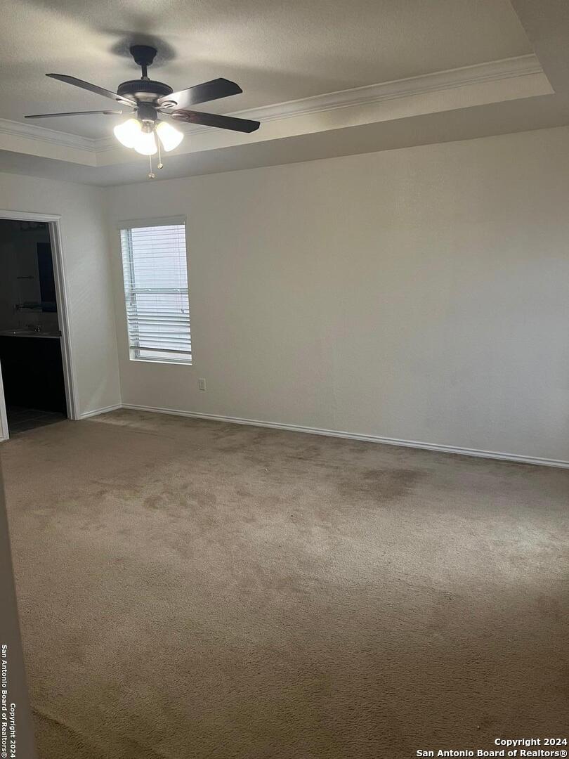 803 Roping Horse San Antonio, TX 78260 - Photo 16 of 18 en empty room with windows and fan