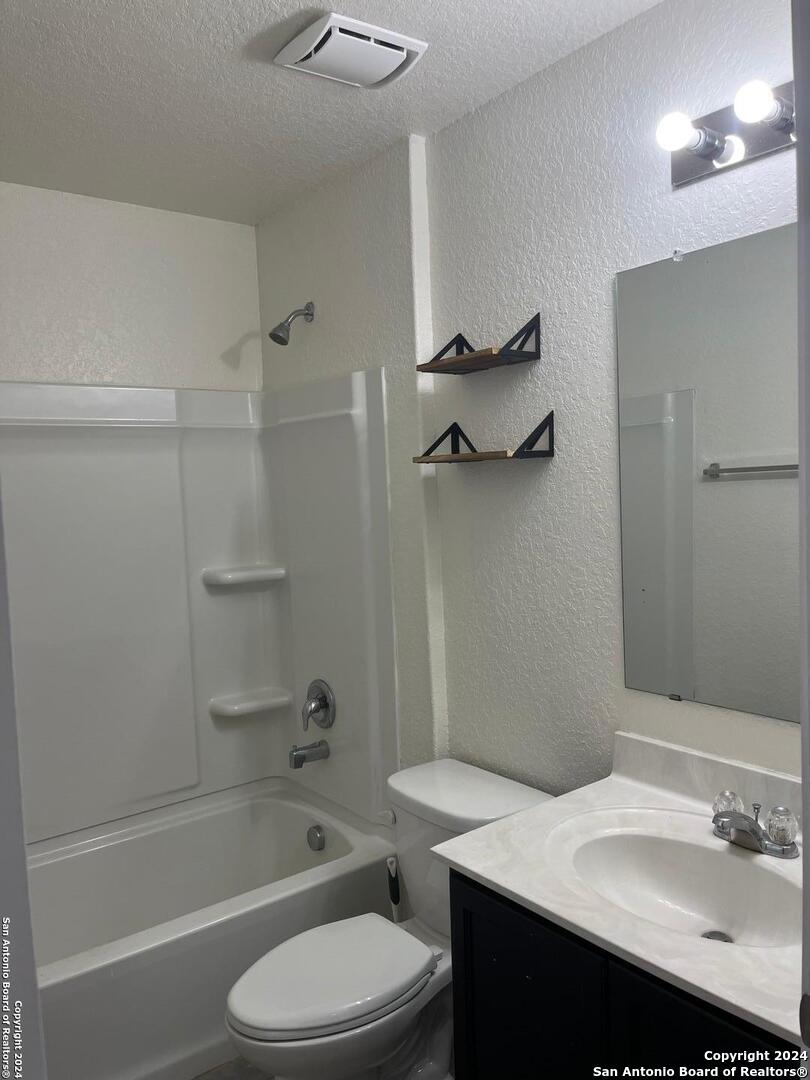 803 Roping Horse San Antonio, TX 78260 - Photo 17 of 18 a bathroom with a sink a toilet and shower