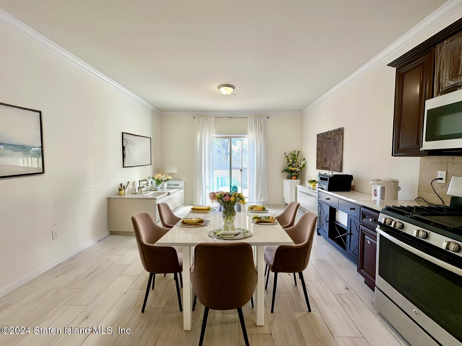 94 Catherine Street Staten Island, NY 10302 - Photo 21 of 33 a view of a dining room with furniture and wooden floor