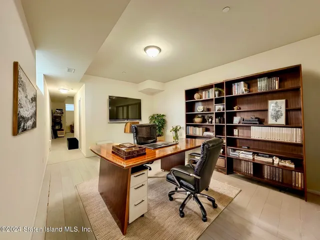 a view of a workspace with furniture