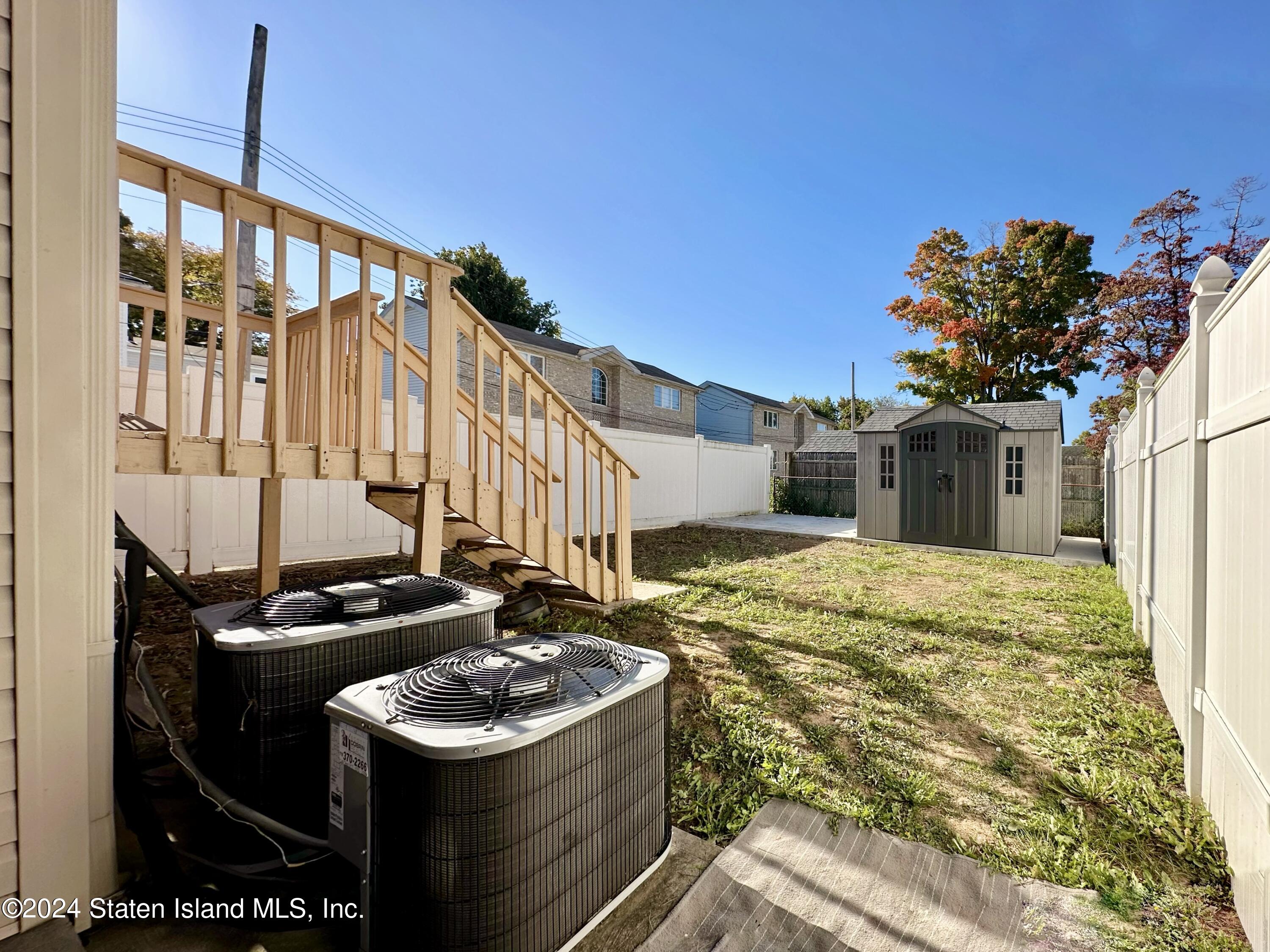 94 Catherine Street Staten Island, NY 10302 - Photo 4 of 33 a bathroom with a sink toilet and shower