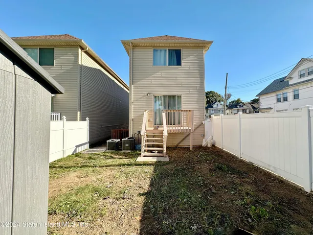 a house view with a backyard space
