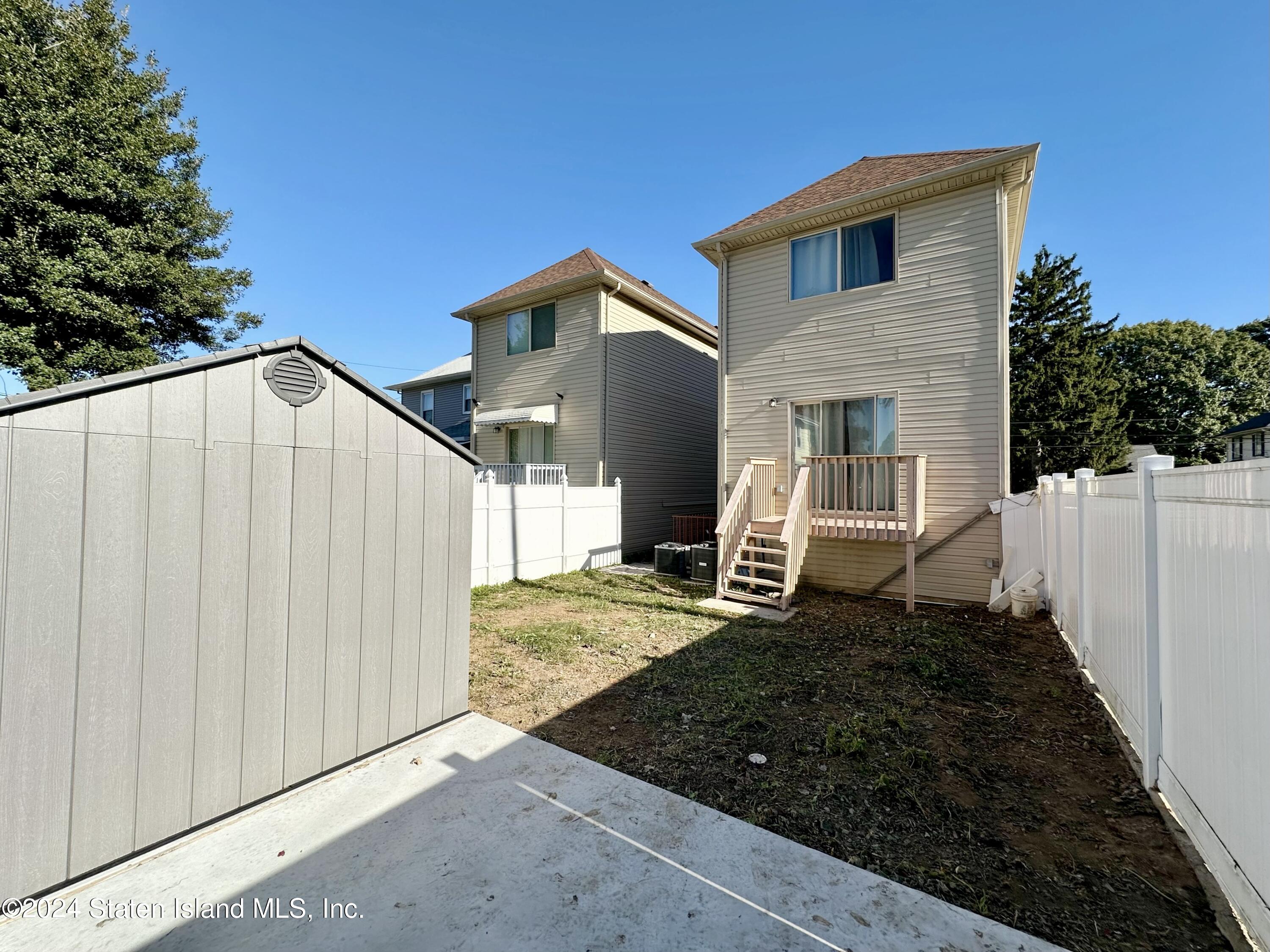 94 Catherine Street Staten Island, NY 10302 - Photo 6 of 33 a view of a house with backyard