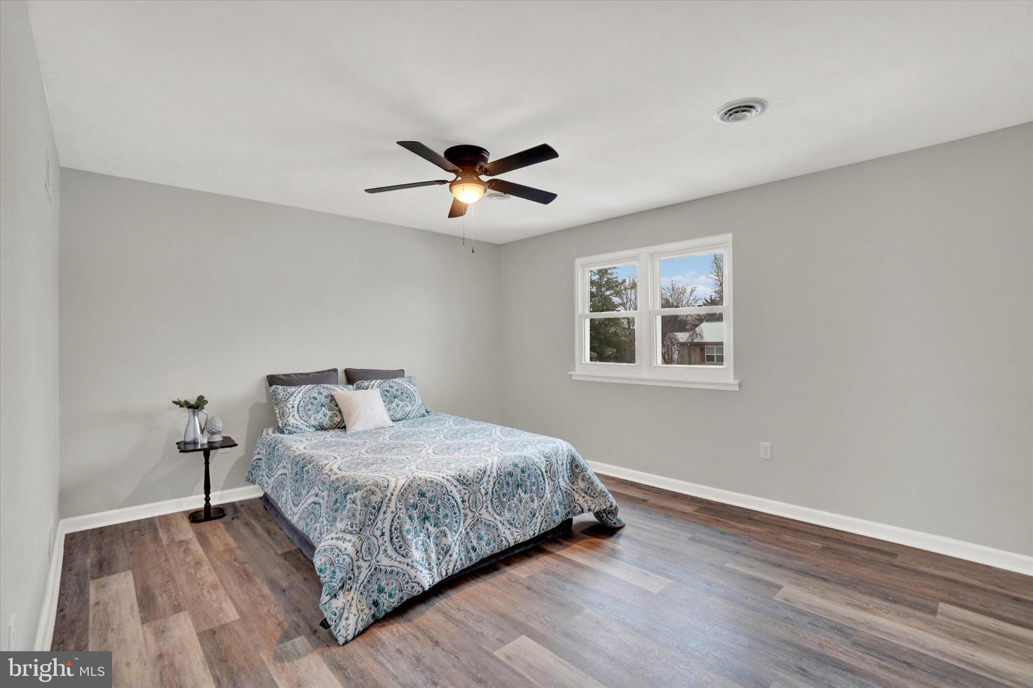 1606 Condor Lane Dover, PA 17315 - Photo 13 of 28 a bedroom with a large bed chandelier and a window