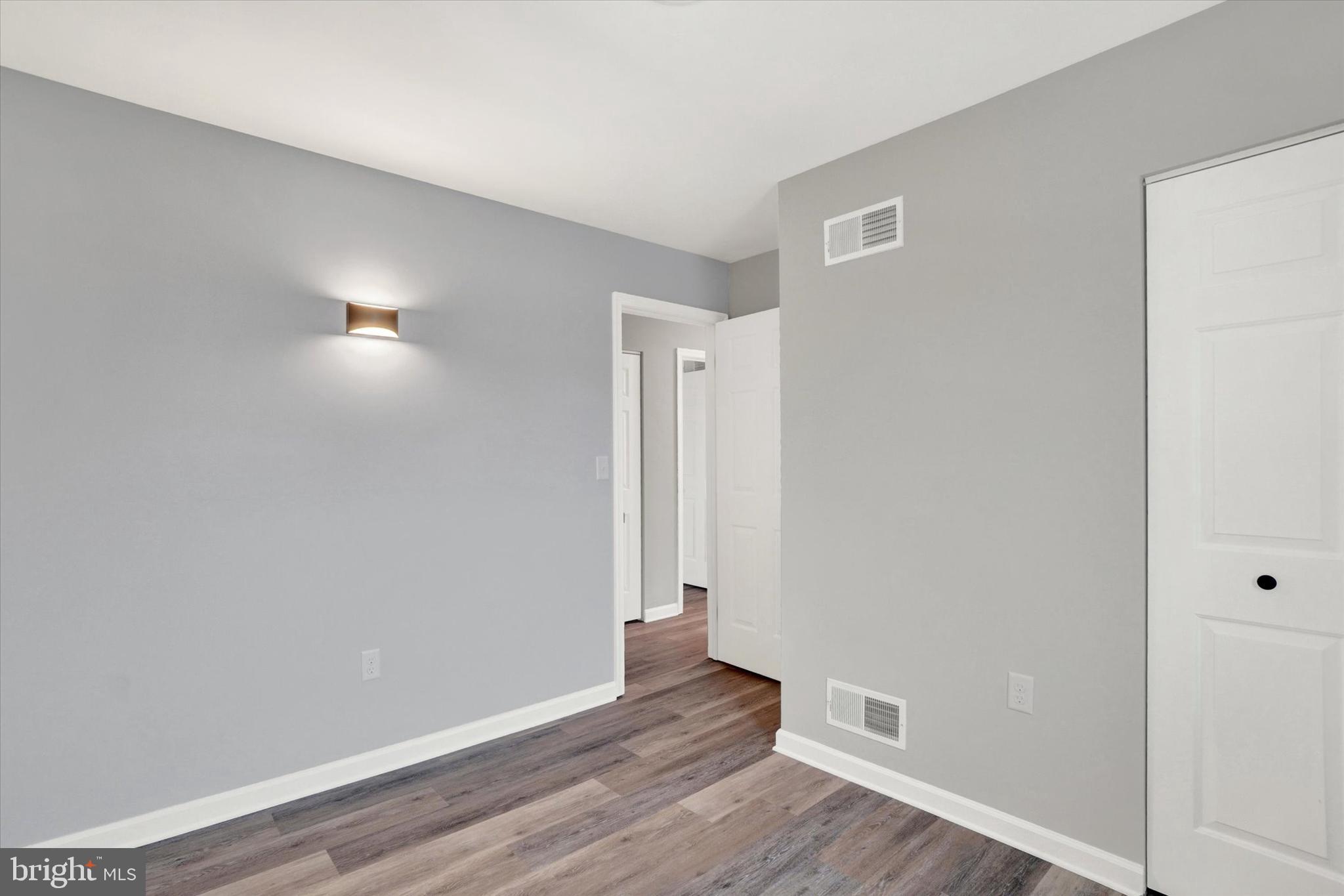 1606 Condor Lane Dover, PA 17315 - Photo 16 of 28 a view of an empty room with wooden floor