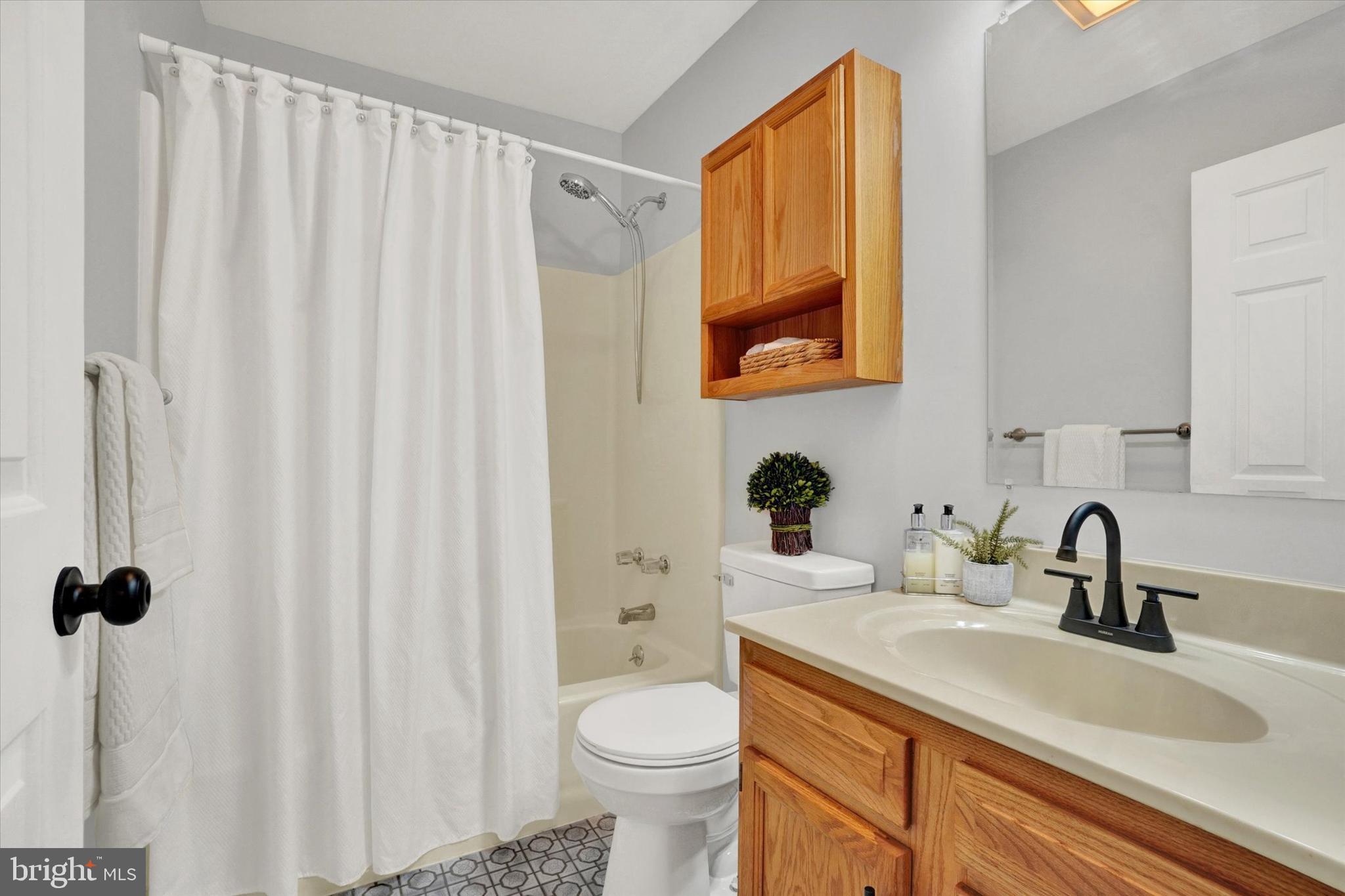 1606 Condor Lane Dover, PA 17315 - Photo 19 of 28 a bathroom with a sink a toilet and a mirror
