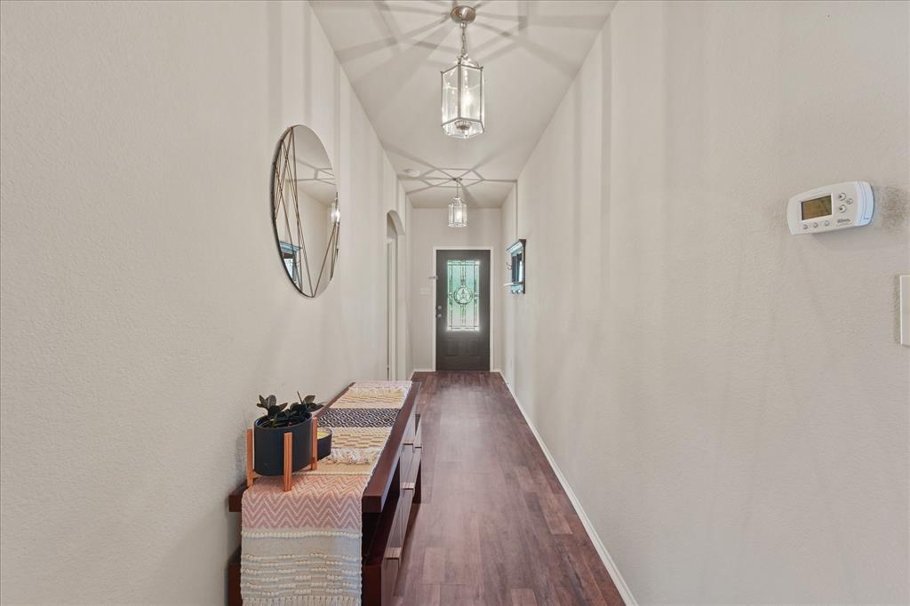 409 Harding Lane Lavon, TX 75166 - Photo 4 of 34 Inviting hallway featuring wood-finish flooring, light neutral wall tones, and recessed lighting