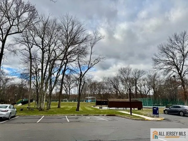 a view of a street with houses on both side of it