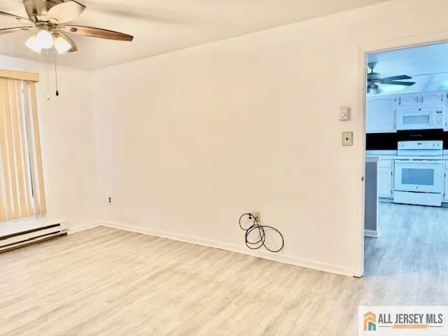 a view of a livingroom with wooden floor