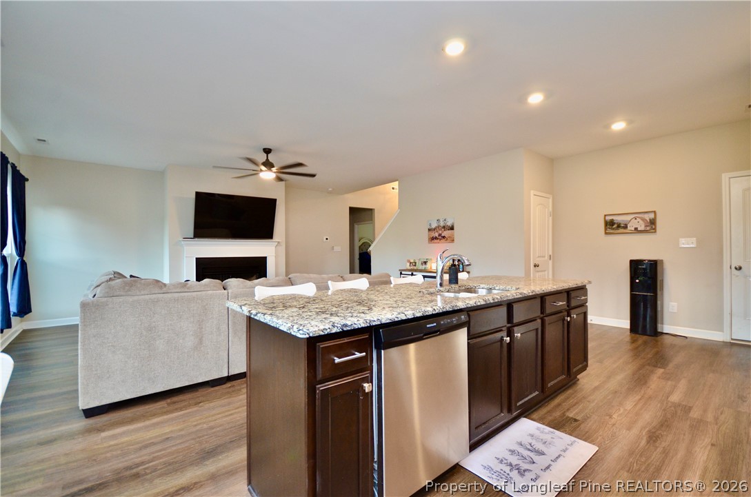 1865 John B Carter Road Fayetteville, NC 28312 - Photo 14 of 49 a living room with stainless steel appliances granite countertop a sink and a flat screen tv