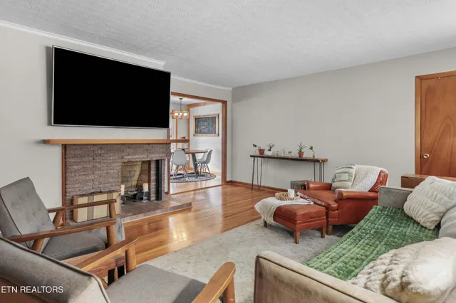 a kitchen with stainless steel appliances granite countertop a stove and wooden floor