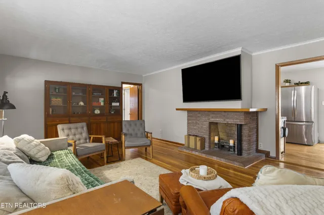 a kitchen with stainless steel appliances a refrigerator a stove a sink and a refrigerator