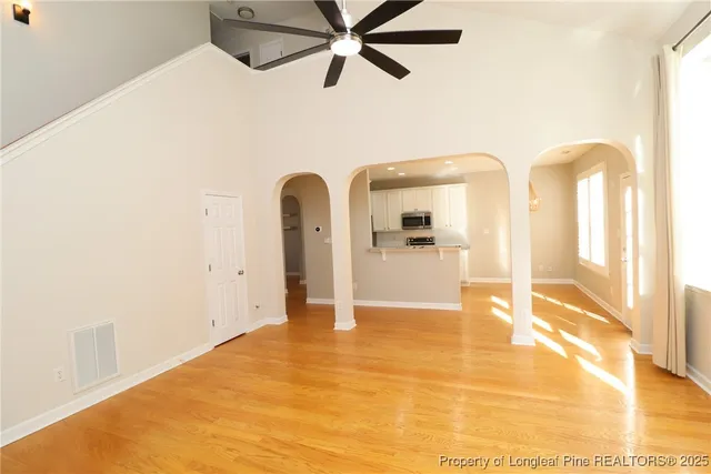 a kitchen with stainless steel appliances granite countertop a sink refrigerator and microwave