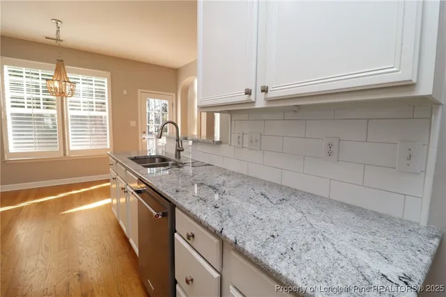 a kitchen with stainless steel appliances a refrigerator stove and microwave