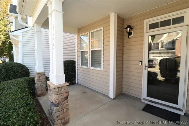 a front view of a house with a large window