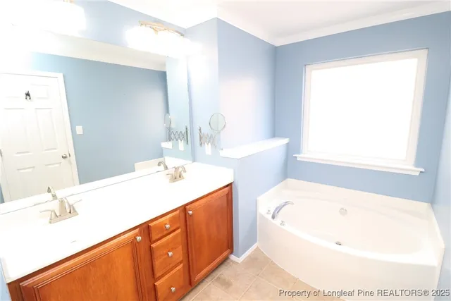 a view of a room with wooden floor and white walls