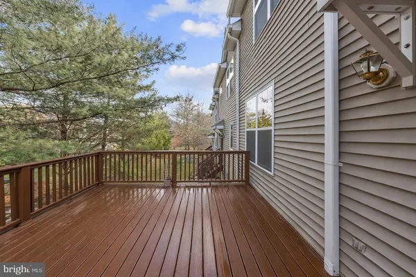 a view of balcony with wooden floor