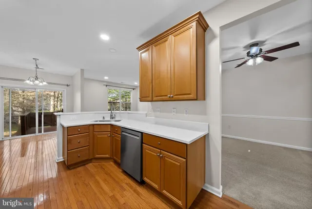 a kitchen with a sink appliances and cabinets