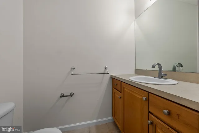 a bathroom with a sink and mirror