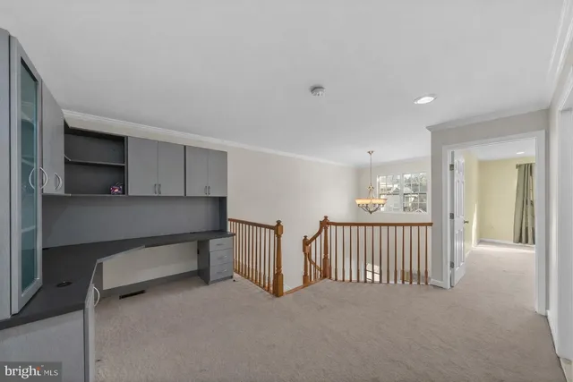 a view of a hallway with seating area