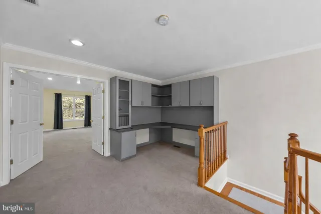 a view of kitchen with refrigerator and wooden floor