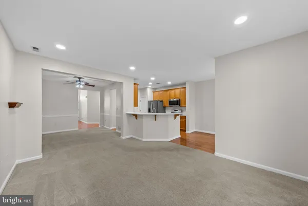 a view of a kitchen with a sink and a couch