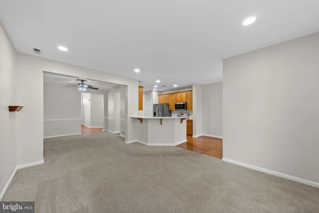 a view of a kitchen with a sink and a couch