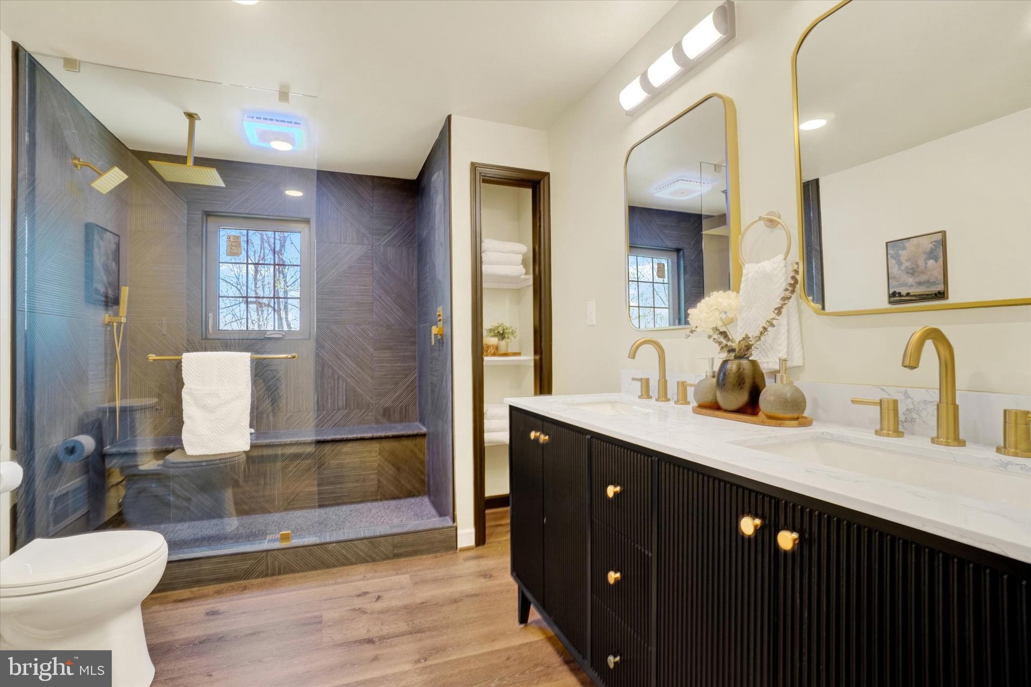 5601 Crone Road Dover, PA 17315 - Photo 19 of 53 a bathroom with a double vanity sink a toilet and mirror
