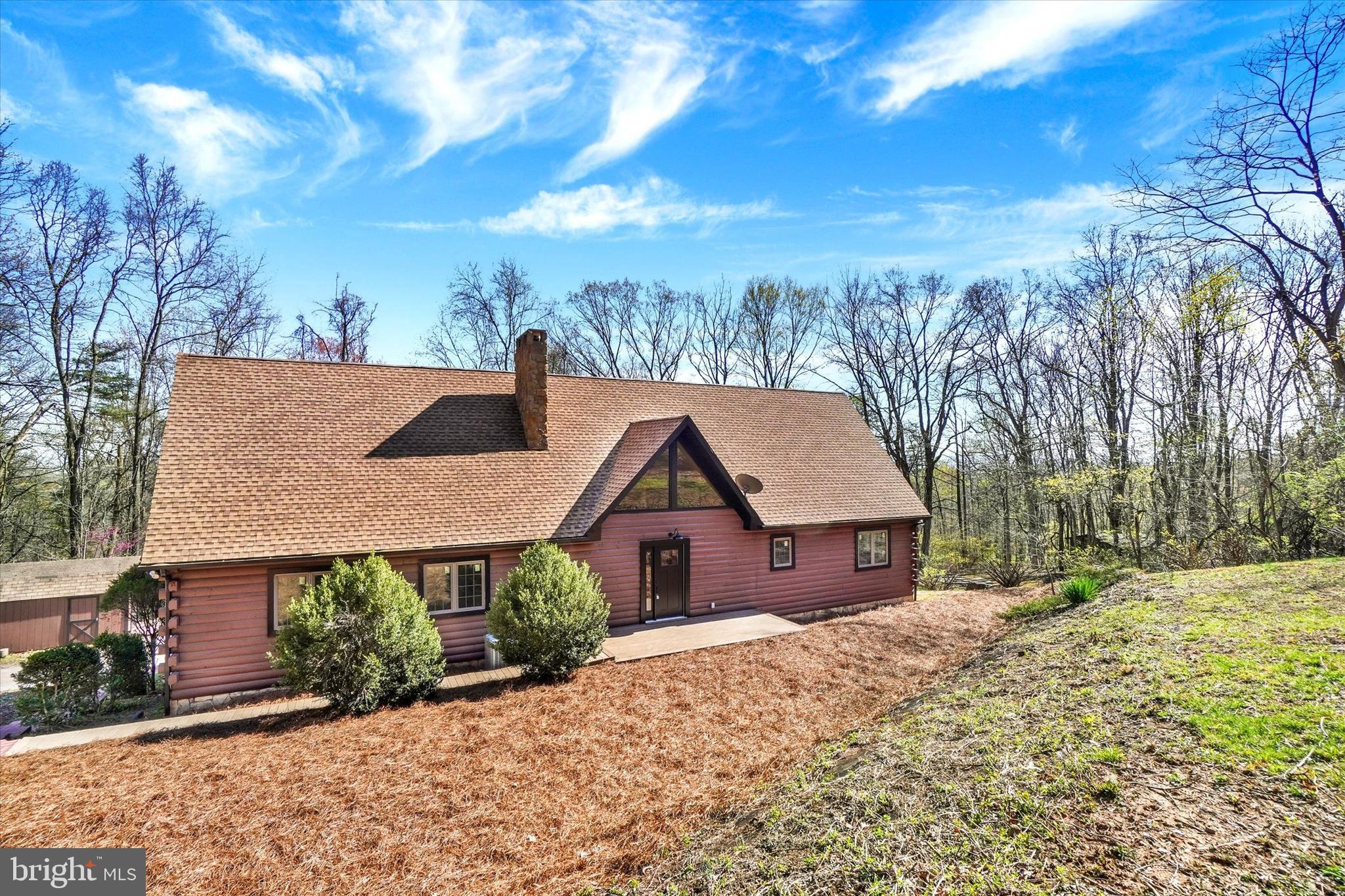 5601 Crone Road Dover, PA 17315 - Photo 2 of 53 a front view of house with yard and trees in the background