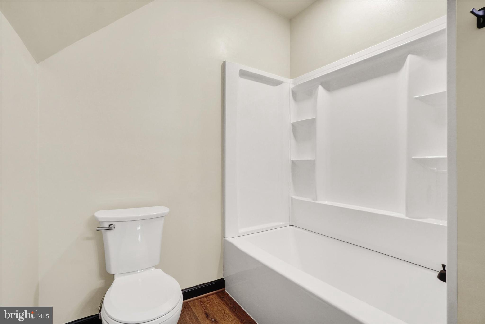 5601 Crone Road Dover, PA 17315 - Photo 30 of 53 a white toilet sitting next to a bath tub