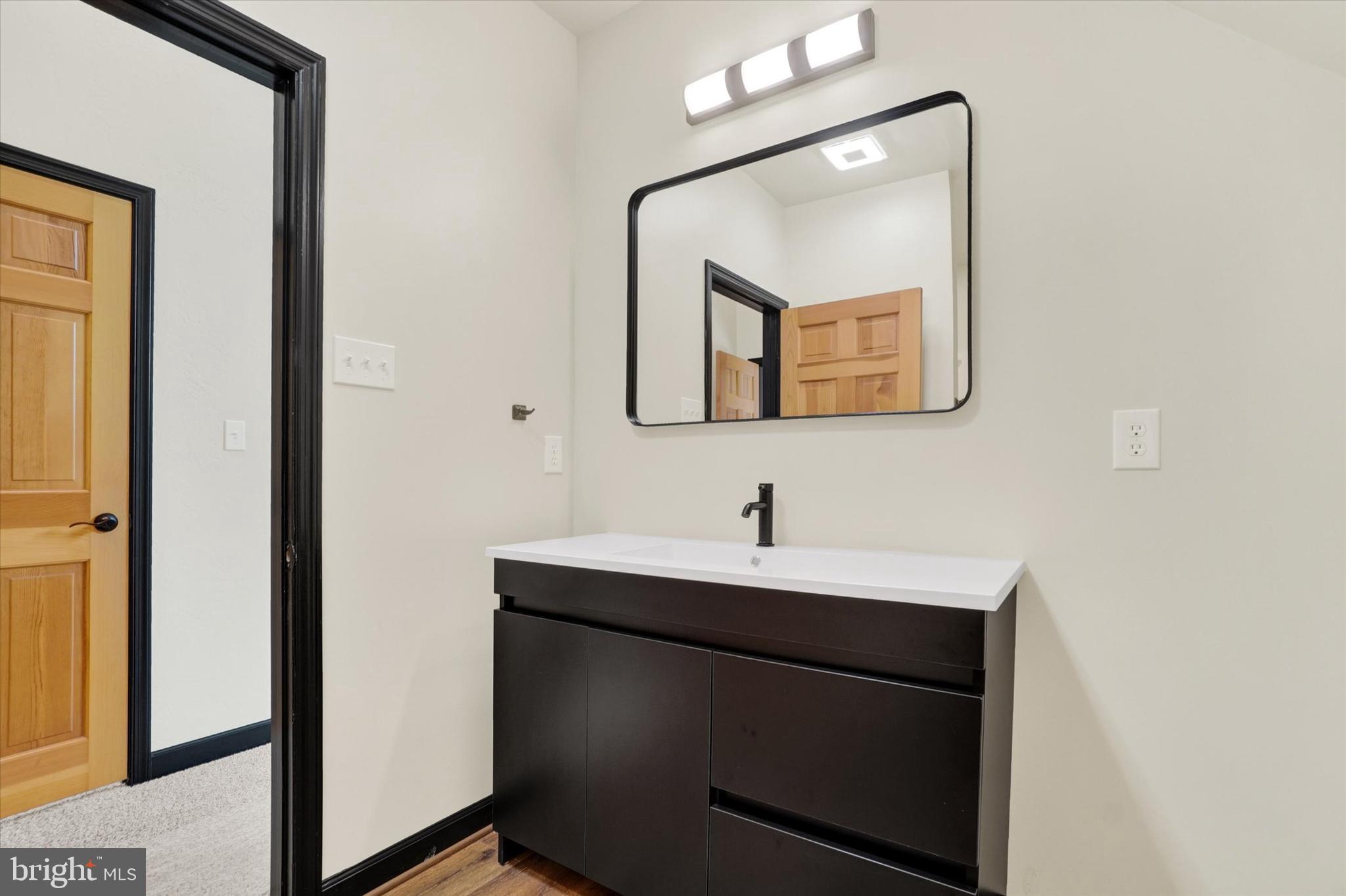 5601 Crone Road Dover, PA 17315 - Photo 31 of 53 a bathroom with a sink and a mirror