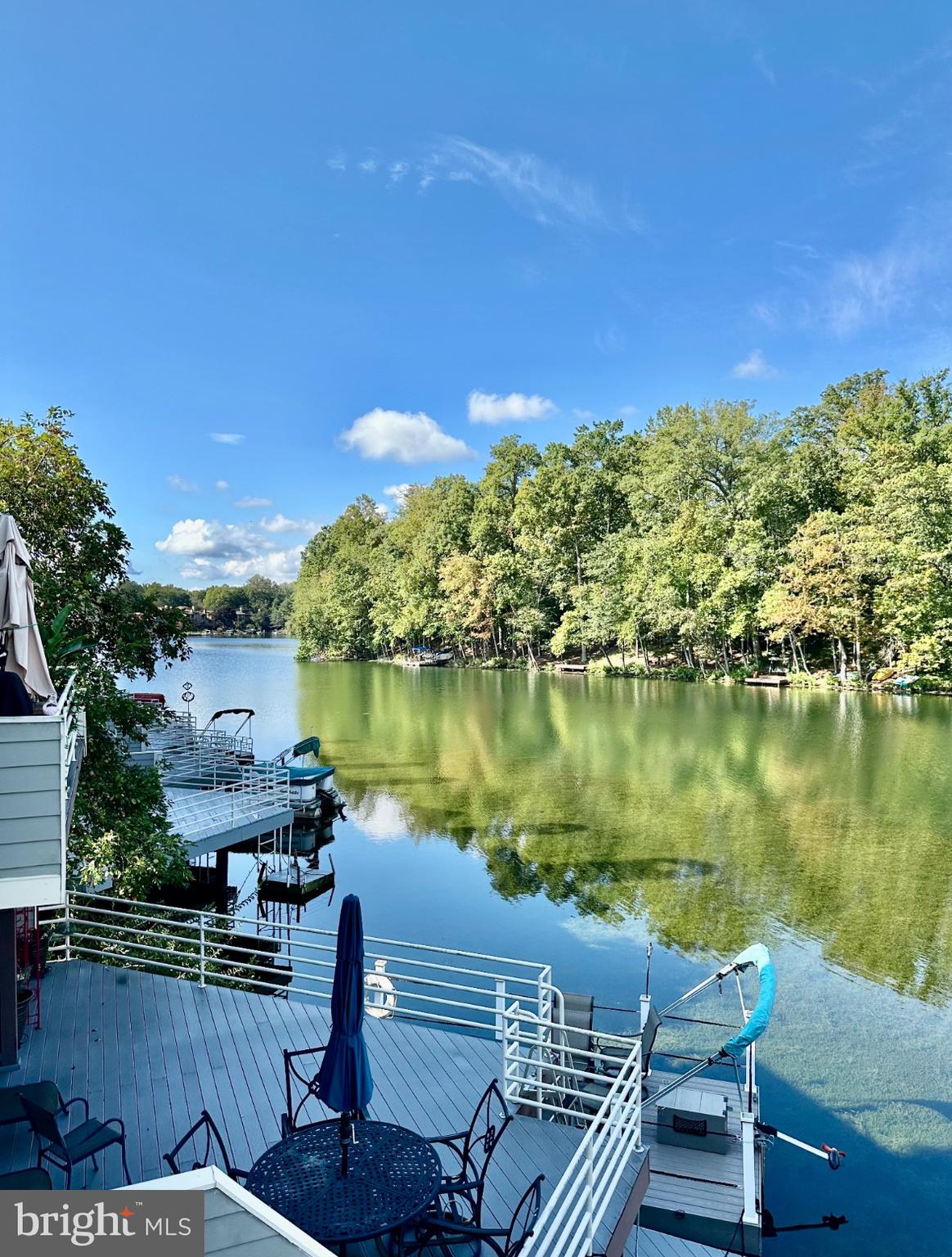 1969 Lakeport Way Reston, VA 20191 - Photo 2 of 11 a view of a lake with a building in front of it