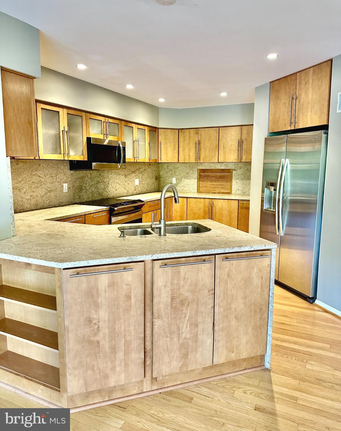 1969 Lakeport Way Reston, VA 20191 - Photo 4 of 11 a view of a kitchen with stainless steel appliances granite countertop a refrigerator and a sink