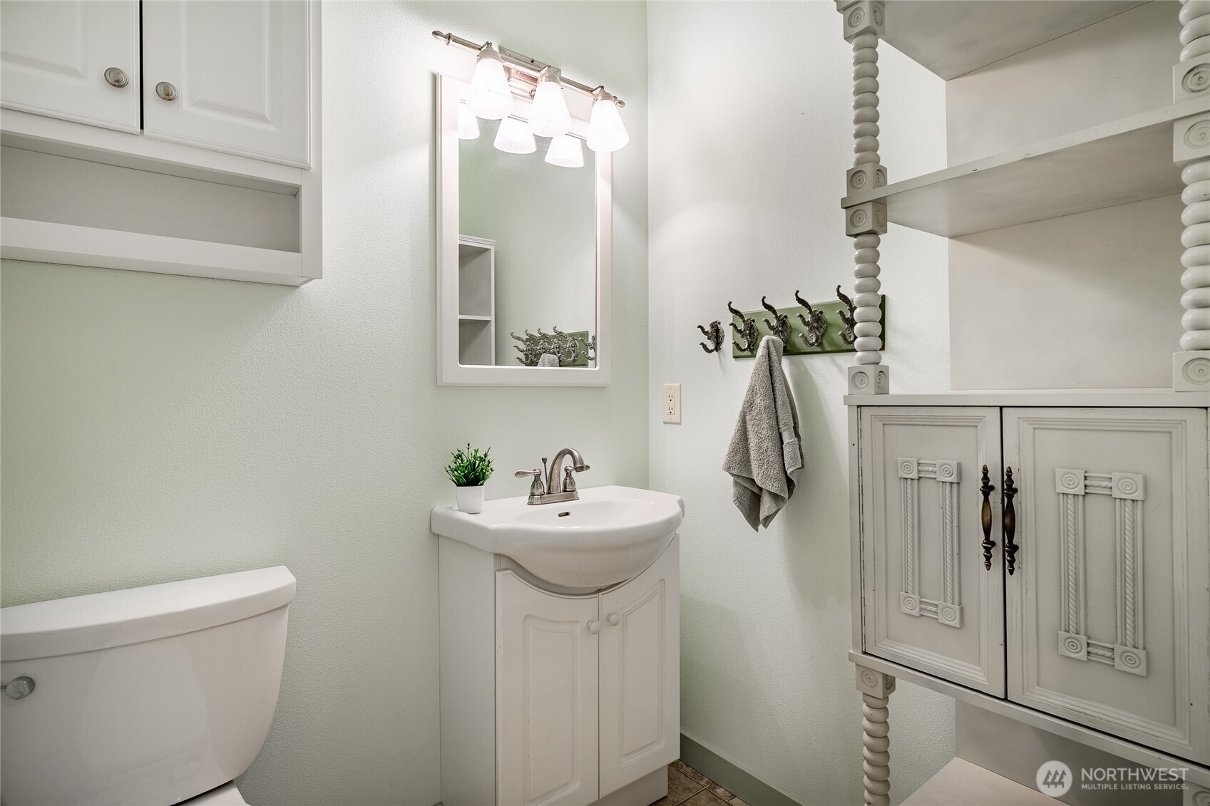 8118 Comox Road Blaine, WA 98230 - Photo 15 of 40 a bathroom with a sink a toilet and mirror