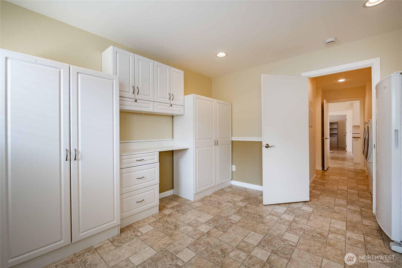 8118 Comox Road Blaine, WA 98230 - Photo 16 of 40 a view of a kitchen with refrigerator and cabinet