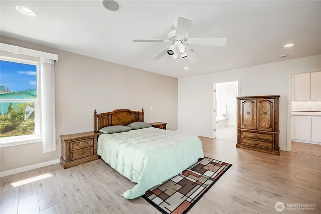 a bathroom with a double vanity sink a mirror a bathtub and shower