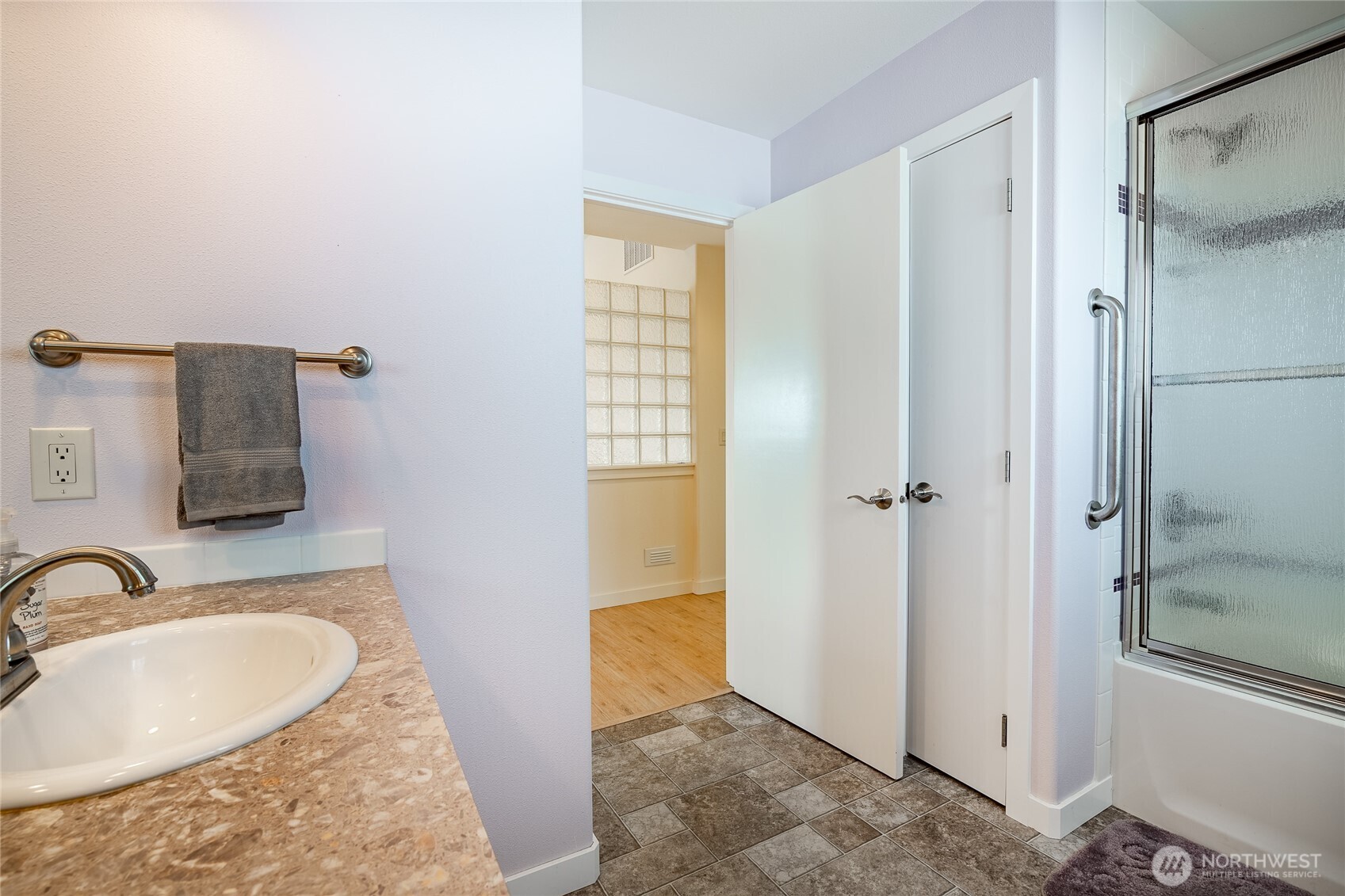 8118 Comox Road Blaine, WA 98230 - Photo 27 of 40 a bathroom with a granite countertop sink and a mirror
