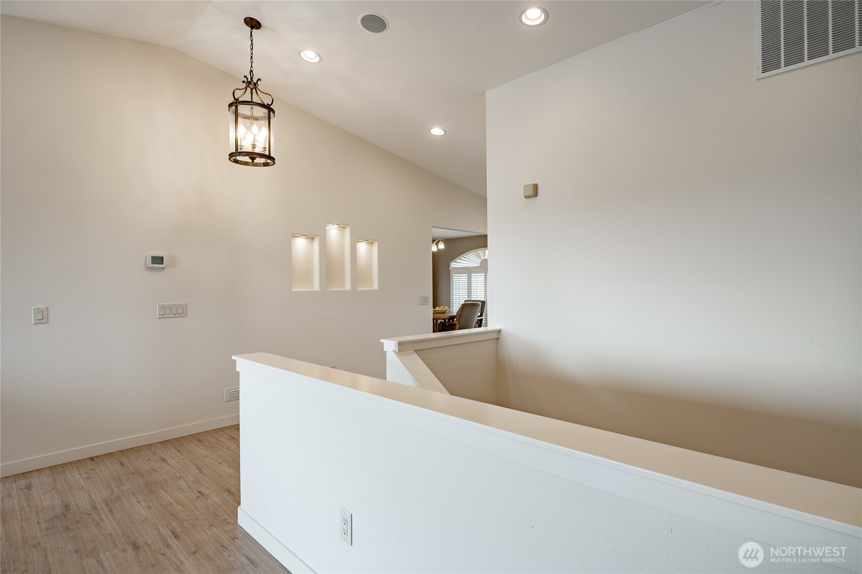 8118 Comox Road Blaine, WA 98230 - Photo 32 of 40 a view of a room with wooden floor and staircase