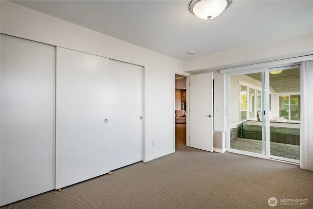 a kitchen with stainless steel appliances granite countertop a refrigerator a sink dishwasher a stove with white cabinets and wooden floor