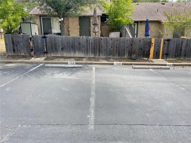front view of a house with a fence