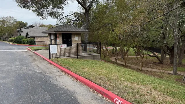 a view of house with a backyard